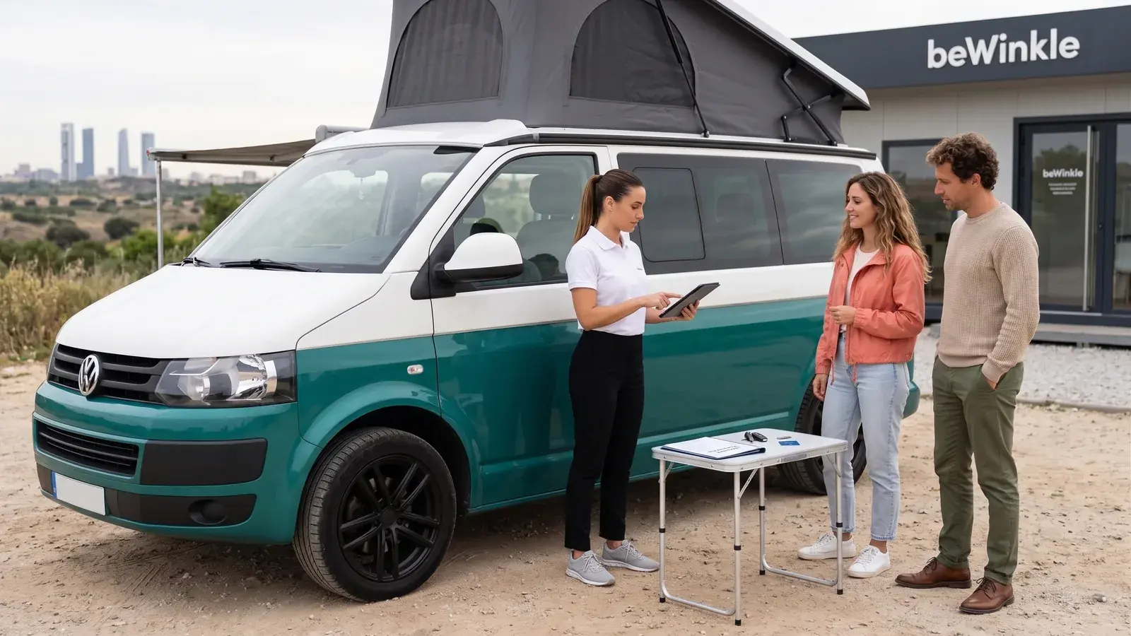 Customer and team member checking a campervan before handing over the keys